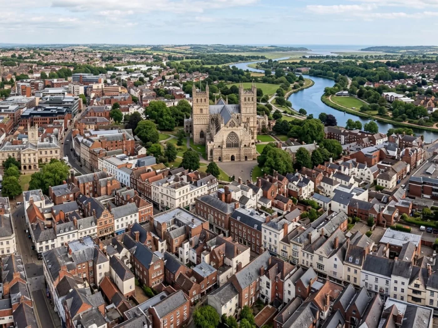 Aerial view over Exeter's mixed rooftops, the surveyor's home base and the centre of the county's coverage area